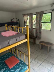 Postel nebo postele na pokoji v ubytování Pura Vida Hostel