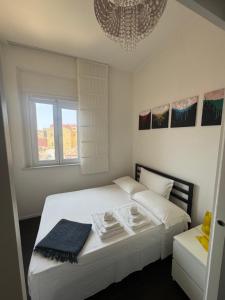 A bed or beds in a room at Attico Baylle