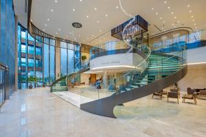 a spiral staircase in a building with a lobby at Liberty Signa in Fethiye
