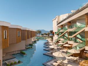 a view of a river between buildings with umbrellas at Liberty Signa in Fethiye