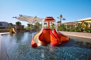 a water slide in a pool at a resort at Liberty Signa in Fethiye