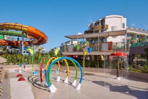 a water park with a water slide and a roller coaster at Liberty Signa in Fethiye