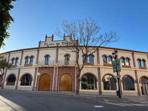 a building on the corner of a street at Apartamento Plaza España in Fuengirola