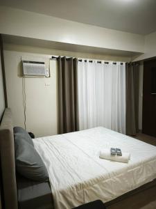 Katil atau katil-katil dalam bilik di Modern Studio Condo in Heart of Quezon City