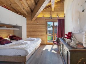 a bedroom with two beds and a wooden ceiling at Duplex Montagne Spacieux avec Cheminée, 4 Chambres - FR-1-570-21 in Praranger