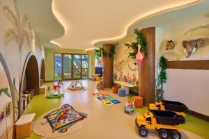 a childs play room with toys on the floor at Liberty Signa in Fethiye