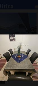 a table with chairs and a potted plant on it at Laguna in Donji Štoj +2 photos