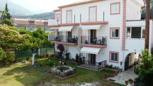 an image of a house with a yard at Perivoli Tessa's in Parga