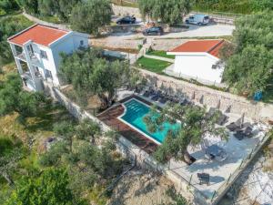 an aerial view of a house with a swimming pool at Olive Grove Luxury with private POOL in Bar