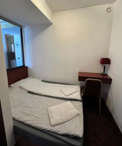 Posteľ alebo postele v izbe v ubytovaní Skipper Apartman