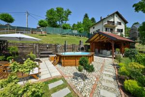 a backyard with a pool and a house at Kuća za odmor Zora in Bregi Radobojski
