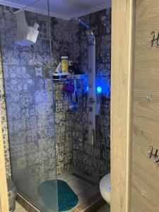 a shower with a glass door in a bathroom at Cozy Rhodes Studio in Rhodes Town