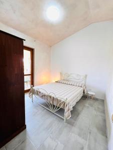 Ένα ή περισσότερα κρεβάτια σε δωμάτιο στο Residence La Cinta 6 - 7