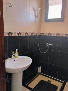 a bathroom with a sink and a shower at Home sweet home in Marrakech in Marrakech