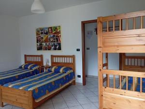 A bed or beds in a room at AGRITURISMO Cré Seren
