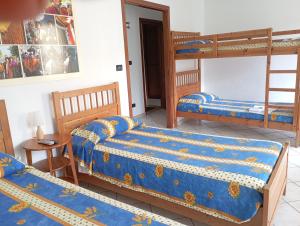 A bed or beds in a room at AGRITURISMO Cré Seren