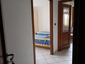 A bed or beds in a room at AGRITURISMO Cré Seren