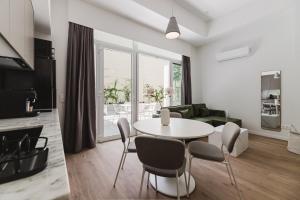 a living room with a table and chairs at Gran Turia Apartments in Valencia