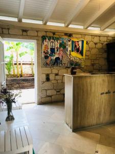 a room with a counter and a stone wall at On Oda Alaçatı in Alaçatı