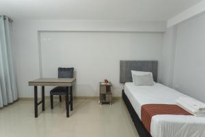 Postel nebo postele na pokoji v ubytování Sumaq Cusco Suites