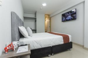 Postel nebo postele na pokoji v ubytování Sumaq Cusco Suites
