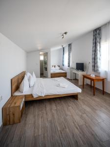 En eller flere senge i et værelse på Casa Amalia