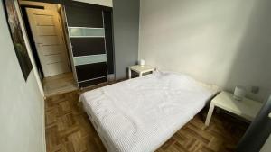 Posteľ alebo postele v izbe v ubytovaní apartament stare-polesie