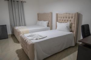 Postel nebo postele na pokoji v ubytování Hostal Gran Real Punta Cana