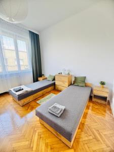 Postel nebo postele na pokoji v ubytování Apartament Symphonia self check in 24h
