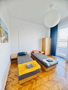 Postel nebo postele na pokoji v ubytování Apartament Symphonia self check in 24h