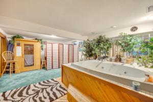 a large bathroom with a large tub in a room at 3 Mi to Garden of the Gods Quiet Home with Hot Tub! in Colorado Springs +33 photos