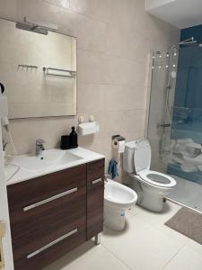 a bathroom with a sink and a toilet and a shower at Casa Sara seaview in Playa Honda +67 photos