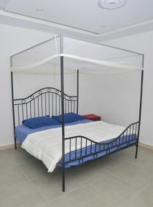 Postel nebo postele na pokoji v ubytování Appartement Moderne, Climatisé, 2 chambres à Ouakam - Dakar, près du Monument de la Renaissance