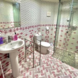 a bathroom with a toilet and a sink and a shower at Marakech home in Marrakesh +25 photos