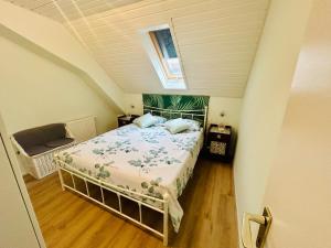 a bedroom with a bed in a attic at La mansardina in Lörrach +8 photos