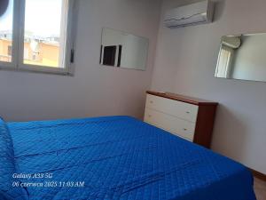 En eller flere senge i et værelse på Appartamento Spiaggia