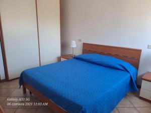 En eller flere senge i et værelse på Appartamento Spiaggia