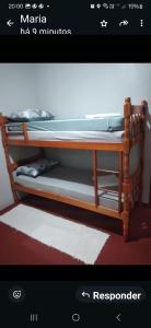 a picture of a bunk bed in a room at Ap confortável in Tramandaí