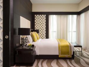Cama o camas de una habitación en Sofitel Abu Dhabi Corniche