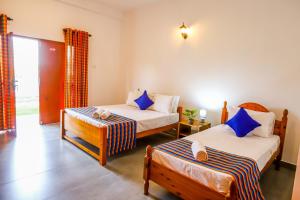 Katil atau katil-katil dalam bilik di Lagoon House Negombo