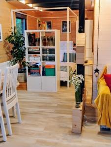 a room with a bed and a table and chairs at 479 Tiny House, Domeniul von Agodt in Bradu +37 photos