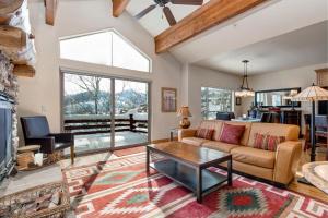 a living room with a couch and a table at Vista Views Pet Friendly in Park City