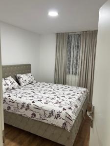a bedroom with a bed and a window at Stan na dan Ana in Prozor