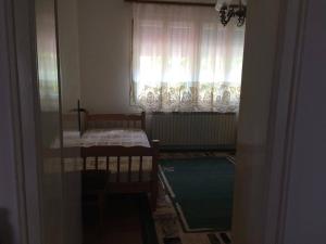 Postel nebo postele na pokoji v ubytování Villa Flora Apartments Krushevo