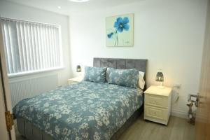 Ένα ή περισσότερα κρεβάτια σε δωμάτιο στο Watermead Retreat Bungalow