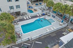an overhead view of a swimming pool at a resort at Spacious 2 Bedroom Condo for up to 8 Guests! Hartford Inlet 100 in Myrtle Beach