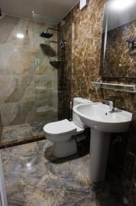 a bathroom with a toilet and a sink and a shower at BaBu shekvetili in Shekhvetili +16 photos