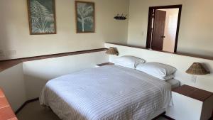 a bedroom with a bed and a mirror on the wall at High Ridge House in Margate