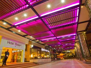 a shopping mall with purple lights on the ceiling at Resorts World Genting - Resort Hotel in Genting Highlands