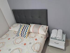 Ένα ή περισσότερα κρεβάτια σε δωμάτιο στο Apartamento amoblado en Neiva +6 φωτογραφίες